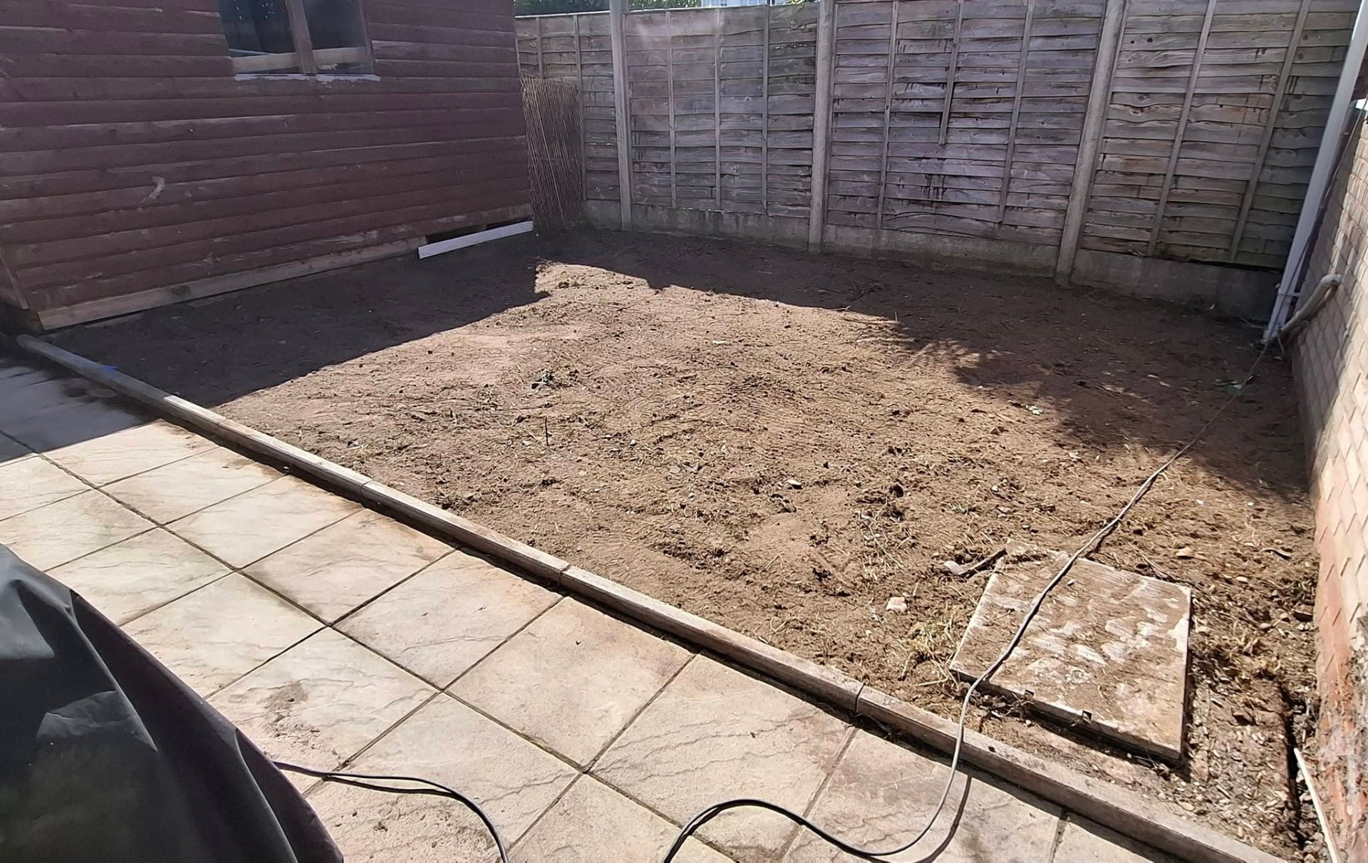 Bare garden area before WJP timber decking work